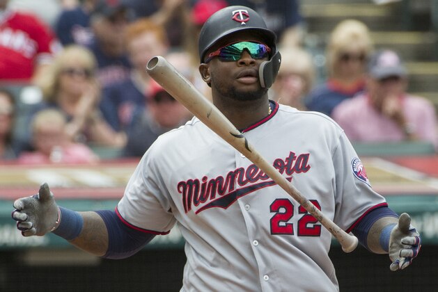 Minnesota Twins' Miguel Sano (22) flips his bat after striking out against the Cleveland Indians during a baseball game in Cleveland, Thursday, Aug. 30, 2018. (AP Photo/Phil Long)