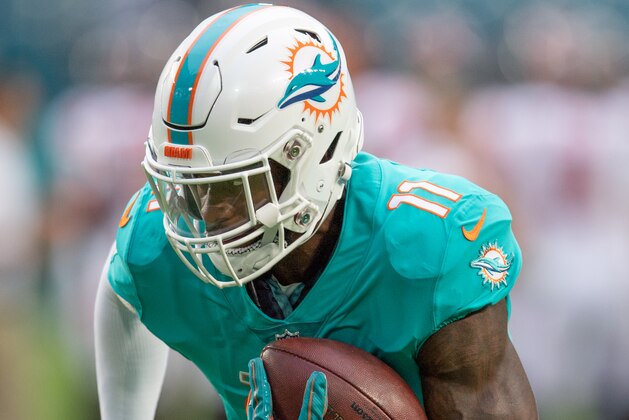 MIAMI, FL - AUGUST 09: DeVante Parker #11 of the Miami Dolphins catches the ball in warmups before a preseason game against the Tampa Bay Buccaneers at Hard Rock Stadium on August 9, 2018 in Miami, Florida. (Photo by Mark Brown/Getty Images)