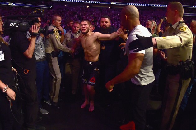 LAS VEGAS, NV - OCTOBER 06:  Khabib Nurmagomedov of Russia is escorted out of the arena after defeating Conor McGregor of Ireland in their UFC lightweight championship bout by way of submission during the UFC 229 event inside T-Mobile Arena on October 6, 2018 in Las Vegas, Nevada.  (Photo by Harry How/Getty Images)