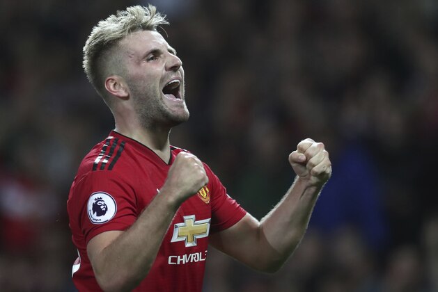 Manchester United's Luke Shaw celebrates after scoring his sides second goal of the game during the English Premier League soccer match between Manchester United and Leicester City at Old Trafford, in Manchester, England, Friday, Aug. 10, 2018. (AP Photo/Jon Super)