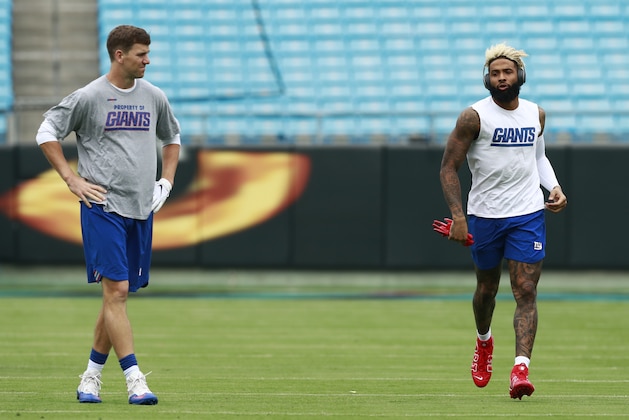 New York Giants' Eli Manning, left, and Odell Beckham, right, warm up before an NFL football game against the Carolina Panthers in Charlotte, N.C., Sunday, Oct. 7, 2018. (AP Photo/Jason E. Miczek)