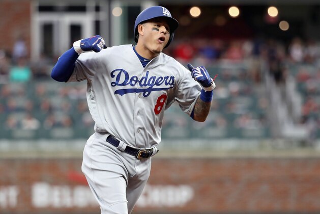 ATLANTA, GA - OCTOBER 08:  Manny Machado #8 of the Los Angeles Dodgers celebrates as he rounds the bases after hitting a three run homerun during the seventh inning of Game Four of the National League Division Series against the Atlanta Braves at Turner Field on October 8, 2018 in Atlanta, Georgia.  (Photo by Rob Carr/Getty Images)