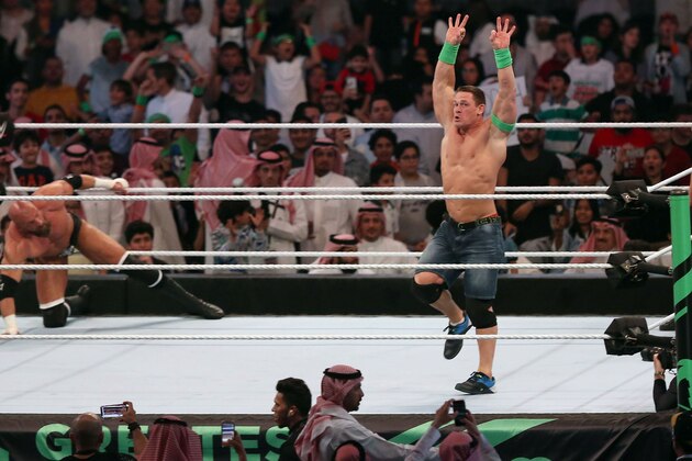 John Cena (R) competes with Triple H (L) during the World Wrestling Entertainment (WWE) Greatest Royal Rumble event in the Saudi coastal city of Jeddah on April 27, 2018. (Photo by STRINGER / AFP)        (Photo credit should read STRINGER/AFP/Getty Images)