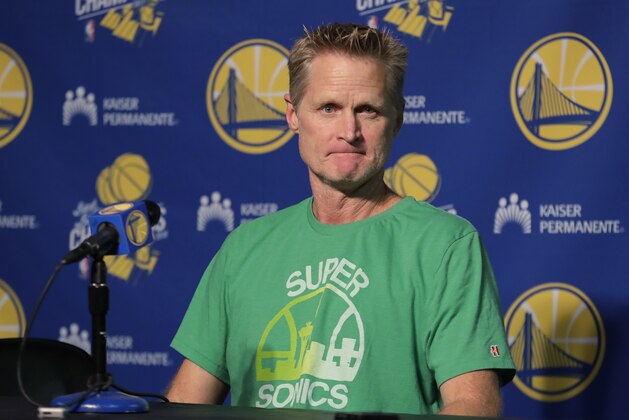 Golden State Warriors coach Steve Kerr wears a Seattle SuperSonics T-shirt as he listens to a question during a news conference before the team's NBA preseason basketball game against the Sacramento Kings on  Friday, Oct. 5, 2018, in Seattle. (AP Photo/Ted S. Warren)