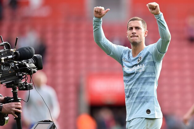 A television broadcast camera films as Chelsea's Belgian midfielder Eden Hazard applauds the fans following the English Premier League football match between Southampton and Chelsea at St Mary's Stadium in Southampton, southern England on October 7, 2018. - Chelsea won the match 3-0. (Photo by Glyn KIRK / AFP) / RESTRICTED TO EDITORIAL USE. No use with unauthorized audio, video, data, fixture lists, club/league logos or 'live' services. Online in-match use limited to 120 images. An additional 40 images may be used in extra time. No video emulation. Social media in-match use limited to 120 images. An additional 40 images may be used in extra time. No use in betting publications, games or single club/league/player publications. /         (Photo credit should read GLYN KIRK/AFP/Getty Images)