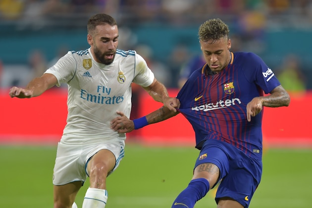 Daniel Carvajal (L) of Real Madrid chases Neymar (R) of Barcelona during their International Champions Cup football match at Hard Rock Stadium on July 29, 2017 in Miami, Florida.      / AFP PHOTO / HECTOR RETAMAL        (Photo credit should read HECTOR RETAMAL/AFP/Getty Images)