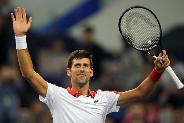 Novak Djokovic of Serbia celebrates after defeating Jeremy Chardy of France during their men's singles first round match at the Shanghai Masters tennis tournament on October 9, 2018. (Photo by Johannes EISELE / AFP)        (Photo credit should read JOHANNES EISELE/AFP/Getty Images)