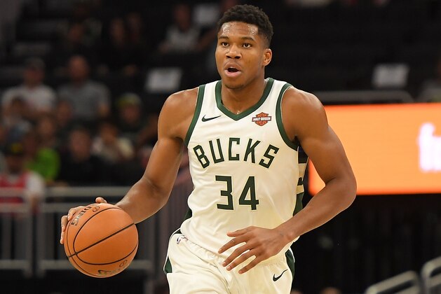 MILWAUKEE, WI - OCTOBER 03:  Giannis Antetokounmpo #34 of the Milwaukee Bucks handles the ball during a preseason game against the Chicago Bulls at the Fiserv Forum on October 3, 2018 in Milwaukee, Wisconsin. NOTE TO USER: User expressly acknowledges and agrees that, by downloading and or using this photograph, User is consenting to the terms and conditions of the Getty Images License Agreement.  (Photo by Stacy Revere/Getty Images)