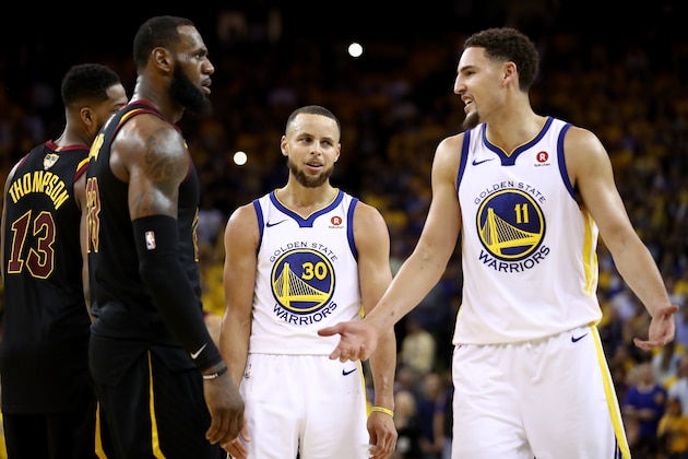 OAKLAND, CA - MAY 31:  Stephen Curry #30 and Klay Thompson #11 of the Golden State Warriors exchange words with LeBron James #23 of the Cleveland Cavaliers in overtime during Game 1 of the 2018 NBA Finals at ORACLE Arena on May 31, 2018 in Oakland, California. NOTE TO USER: User expressly acknowledges and agrees that, by downloading and or using this photograph, User is consenting to the terms and conditions of the Getty Images License Agreement.  (Photo by Ezra Shaw/Getty Images)