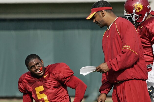 Southern California tail back Reggie Bush, left, listens to running backs coach Todd McNair, center, as LenDale White looks on during a work-out in Los Angeles Thursday, Dec. 29, 2005. The Trojans face the University of Texas in the national championship game at the Rose Bowl on Wednesday, Jan. 4, 2006. (AP Photo/Kevork Djansezian) Southern California tail back Reggie Bush, left, listens to running backs coach Todd McNair, center, as LenDale White looks on during a work-out in Los Angeles Thursday, Dec. 29, 2005. The Trojans face the University of Texas in the national championship game at the Rose Bowl on Wednesday, Jan. 4, 2006. (AP Photo/Kevork Djansezian)