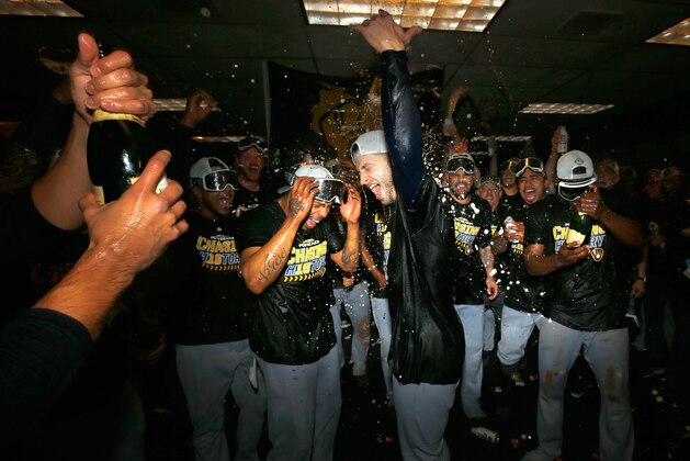 DENVER, CO - OCTOBER 07:  Ryan Braun #8 of the Milwaukee Brewers celebrates in the locker room after his team won Game Three to clinch the National League Division Series by defeating the Colorado Rockies at Coors Field on October 7, 2018 in Denver, Colorado. The Brewers won the game 6-0 and the series 3-0.  (Photo by Justin Edmonds/Getty Images)