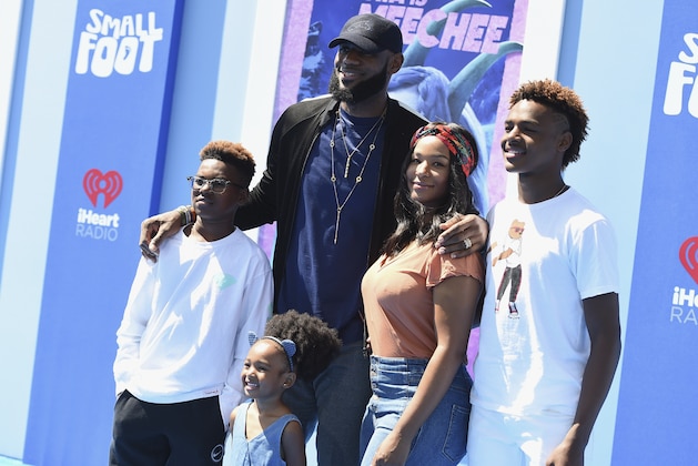 Professional NBA player LeBron James of the Los Angeles Lakers, third left, Savannah James, second right, and from left, Bryce Maximus James, Zhuri James and LeBron James Jr. arrive at the world premiere of