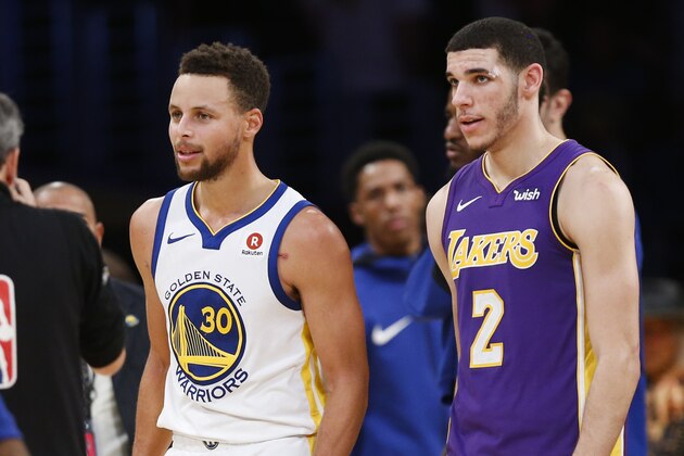 Los Angeles Lakers guard Lonzo Ball #2 and Golden State Warriors guard Stephen Curry #30 in an NBA basketball game Wednesday, Nov. 29, 2017, in Los Angeles. Golden State Warriors won 127-123 in overtime. (AP Photo/Ringo H.W. Chiu)