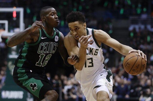 Milwaukee Bucks' Malcolm Brogdon tries to drive past Boston Celtics' Terry Rozier during the first half of Game 4 of an NBA basketball first-round playoff series Sunday, April 22, 2018, in Milwaukee. (AP Photo/Morry Gash)