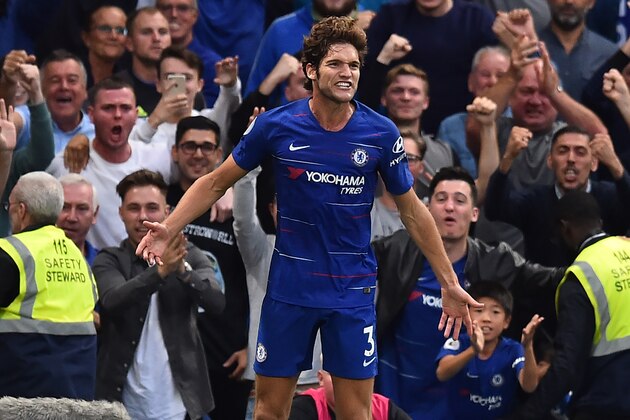 Chelsea's Spanish defender Marcos Alonso celebrates after scoring their third goal during the English Premier League football match between Chelsea and Arsenal at Stamford Bridge in London on August 18, 2018. (Photo by Glyn KIRK / AFP) / RESTRICTED TO EDITORIAL USE. No use with unauthorized audio, video, data, fixture lists, club/league logos or 'live' services. Online in-match use limited to 120 images. An additional 40 images may be used in extra time. No video emulation. Social media in-match use limited to 120 images. An additional 40 images may be used in extra time. No use in betting publications, games or single club/league/player publications. / (Photo credit should read GLYN KIRK/AFP/Getty Images) Chelsea's Spanish defender Marcos Alonso celebrates after scoring their third goal during the English Premier League football match between Chelsea and Arsenal at Stamford Bridge in London on August 18, 2018. (Photo by Glyn KIRK / AFP) / RESTRICTED TO EDITORIAL USE. No use with unauthorized audio, video, data, fixture lists, club/league logos or 'live' services. Online in-match use limited to 120 images. An additional 40 images may be used in extra time. No video emulation. Social media in-match use limited to 120 images. An additional 40 images may be used in extra time. No use in betting publications, games or single club/league/player publications. / (Photo credit should read GLYN KIRK/AFP/Getty Images)