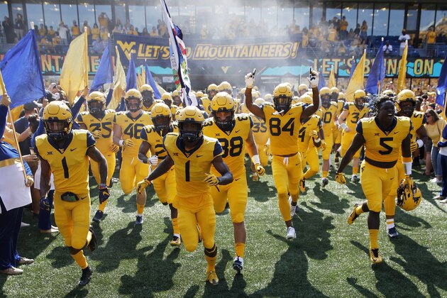 MORGANTOWN, WV - OCTOBER 06: West Virginia Mountaineers take the field before the game against the Kansas Jayhawks at Mountaineer Field on October 6, 2018 in Morgantown, West Virginia. (Photo by Joe Robbins/Getty Images)