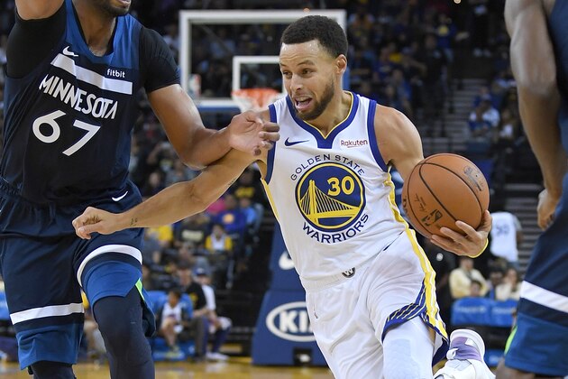 OAKLAND, CA - SEPTEMBER 29:  Stephen Curry #30 of the Golden State Warriors drives on Taj Gibson #67 of the Minnesota Timberwolves during an NBA basketball game at ORACLE Arena on September 29, 2018 in Oakland, California. NOTE TO USER: User expressly acknowledges and agrees that, by downloading and or using this photograph, User is consenting to the terms and conditions of the Getty Images License Agreement.  (Photo by Thearon W. Henderson/Getty Images)