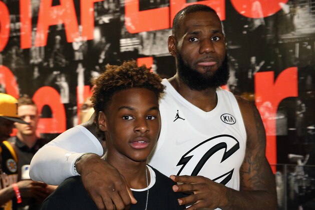 LOS ANGELES, CA - FEBRUARY 18: LeBron James #23 of team LeBron walks with his son during the NBA All-Star Game as a part of 2018 NBA All-Star Weekend at STAPLES Center on February 18, 2018 in Los Angeles, California. NOTE TO USER: User expressly acknowledges and agrees that, by downloading and/or using this photograph, user is consenting to the terms and conditions of the Getty Images License Agreement.  Mandatory Copyright Notice: Copyright 2018 NBAE (Photo by Chris Marion/NBAE via Getty Images)