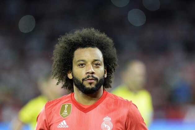 Real Madrid's Brazilian defender Marcelo (C) looks on before the Spanish league football match Sevilla FC against Real Madrid CF at the Ramon Sanchez Pizjuan stadium in Seville on September 26, 2018. (Photo by CRISTINA QUICLER / AFP)        (Photo credit should read CRISTINA QUICLER/AFP/Getty Images)
