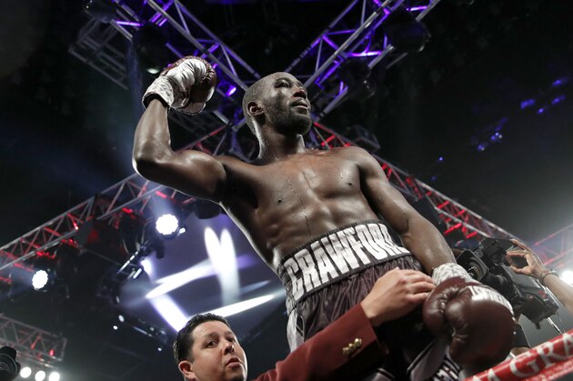 FILE - In this June 9, 2018, file photo, Terence Crawford celebrates after defeating Jeff Horn, of Australia, in a welterweight title boxing match in Las Vegas. Crawford said he’s eager to make unbeaten challenger Jose Benavidez Jr. eat his words when they meet in the ring in Omaha, Neb., on Oct. 13.  (AP Photo/John Locher, File)