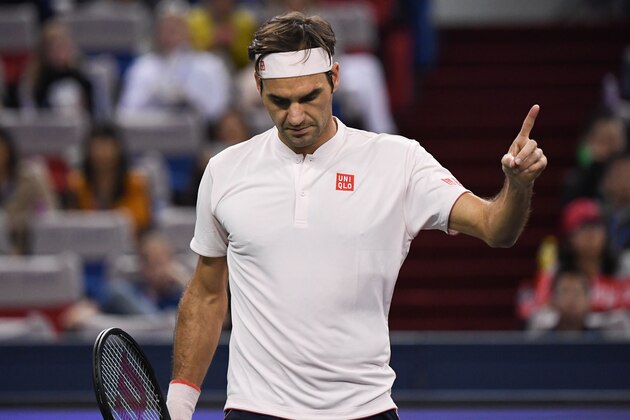 Switzerland's Roger Federer reacts after winning a point against Spain's Roberto Bautista Agut during their men's singles third round match at the Shanghai Masters tennis tournament on October 11, 2018. (Photo by WANG ZHAO / AFP)        (Photo credit should read WANG ZHAO/AFP/Getty Images)