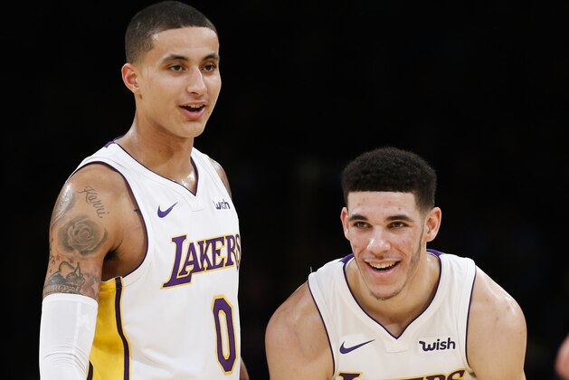 Los Angeles Lakers forward Kyle Kuzma #0 and guard Lonzo Ball #2 in the first half of an NBA basketball game Sunday, Nov. 19, 2017, in Los Angeles. (AP Photo/Ringo H.W. Chiu)