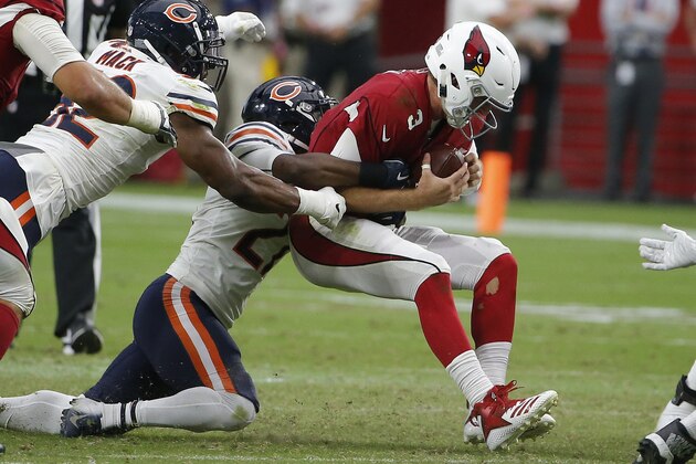 Arizona Cardinals quarterback Josh Rosen (3) gets sacked by Chicago Bears defensive back Sherrick McManis, middle, as Bears linebacker Khalil Mack, left, closes in during the second half of an NFL football game, Sunday, Sept. 23, 2018, in Glendale, Ariz. The Bears defeated the Cardinals 16-14. (AP Photo/Rick Scuteri)