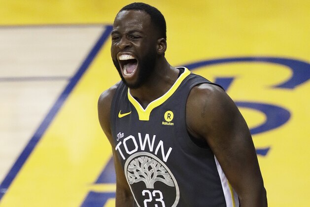 Golden State Warriors forward Draymond Green (23) celebrates after scoring against the Cleveland Cavaliers during the first half of Game 2 of basketball's NBA Finals in Oakland, Calif., Sunday, June 3, 2018. (AP Photo/Marcio Jose Sanchez)