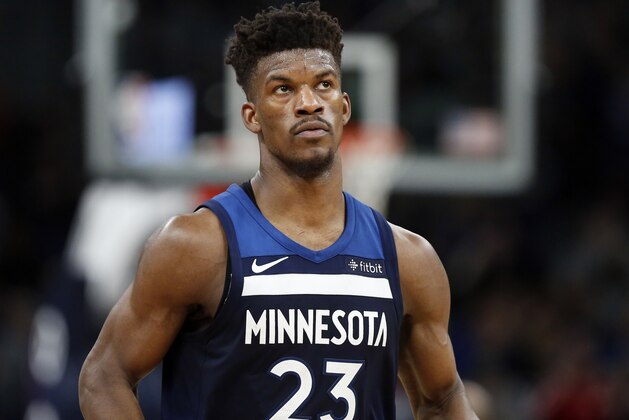 FILE - In this Feb. 11, 2018, file photo, Minnesota Timberwolves forward Jimmy Butler (23)  watches in the third quarter of an NBA basketball game against the Sacramento Kings in Minneapolis. Butler isn't the first NBA star to ask for a trade, nor will he be the last. But it's far from guaranteed that even if he succeeds in forcing Minnesota into making a move he'll wind up in a place he wants. (AP Photo/Andy Clayton-King, File)