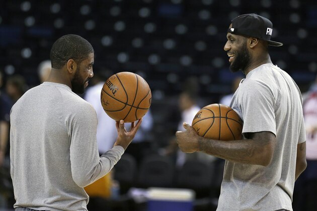 Cleveland Cavaliers' Kyrie Irving, left, and LeBron James talk during NBA basketball practice, Wednesday, June 3, 2015, in Oakland, Calif. The Golden State Warriors host the Cavaliers in Game 1 of the NBA Finals on Thursday. (AP Photo/Ben Margot)
