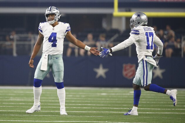 Dallas Cowboys quarterback Dak Prescott (4) slaps hands with wide receiver Allen Hurns (17) during the first half of a preseason NFL football game against the Cincinnati Bengals in Arlington, Texas, Saturday, Aug. 18, 2018. (AP Photo/Ron Jenkins)