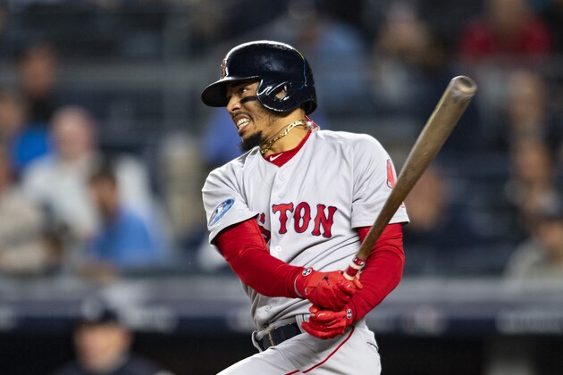 NEW YORK, NY - OCTOBER 8: Mookie Betts #50 of the Boston Red Sox hits a single during the third inning of game three of the American League Division Series against the New York Yankees on October 8, 2018 at Yankee Stadium in the Bronx borough of New York City. (Photo by Billie Weiss/Boston Red Sox/Getty Images)
