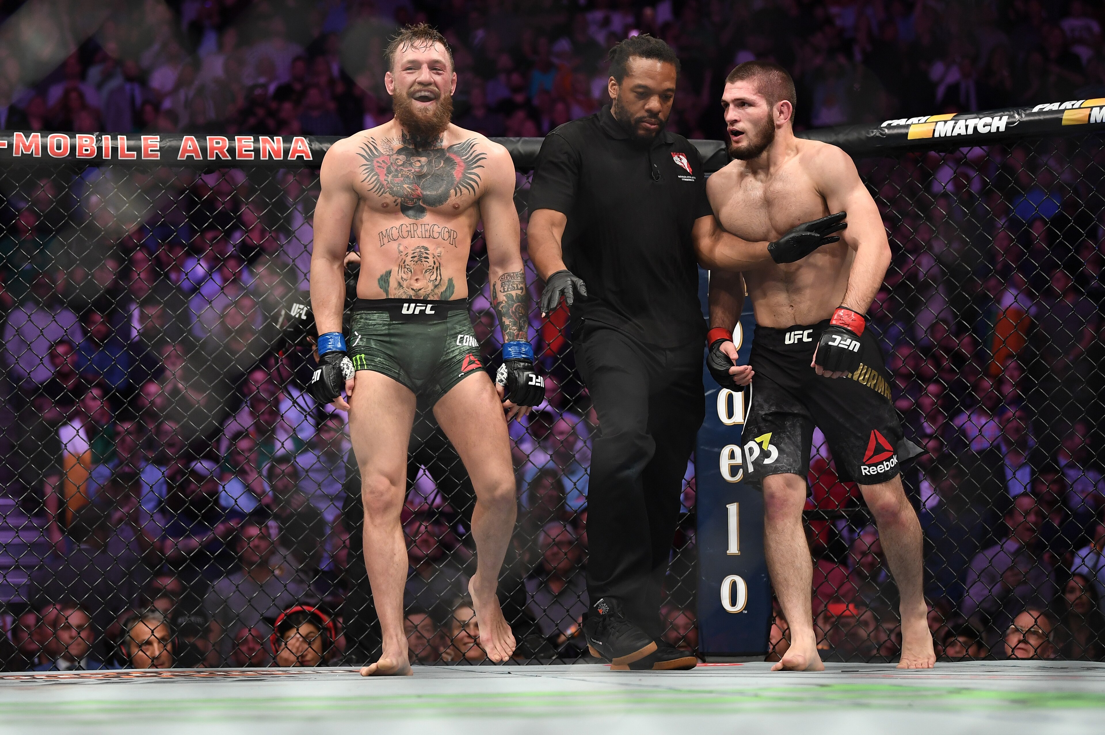 LAS VEGAS, NV - OCTOBER 06: (L-R) Conor McGregor of Ireland and Khabib Nurmagomedov of Russia exchange words after the second round in their UFC lightweight championship bout during the UFC 229 event inside T-Mobile Arena on October 6, 2018 in Las Vegas, Nevada. (Photo by Jeff Bottari/Zuffa LLC/Zuffa LLC via Getty Images) LAS VEGAS, NV - OCTOBER 06: (L-R) Conor McGregor of Ireland and Khabib Nurmagomedov of Russia exchange words after the second round in their UFC lightweight championship bout during the UFC 229 event inside T-Mobile Arena on October 6, 2018 in Las Vegas, Nevada. (Photo by Jeff Bottari/Zuffa LLC/Zuffa LLC via Getty Images)