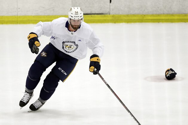 Nashville Predators left wing Austin Watson skates with the puck during NHL hockey training camp Saturday, Sept. 15, 2018, in Nashville, Tenn. Watson has been suspended 27 games without pay by the NHL because of a domestic assault charge. (AP Photo/Mark Humphrey)