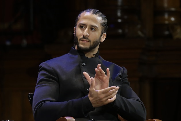 Former NFL football quarterback Colin Kaepernick applauds while seated on stage during W.E.B. Du Bois Medal ceremonies, Thursday, Oct. 11, 2018, at Harvard University, in Cambridge, Mass. Kaepernick is among eight recipients of Harvard University's W.E.B. Du Bois Medals in 2018. Harvard has awarded the medal since 2000 to people whose work has contributed to African and African-American culture.(AP Photo/Steven Senne)