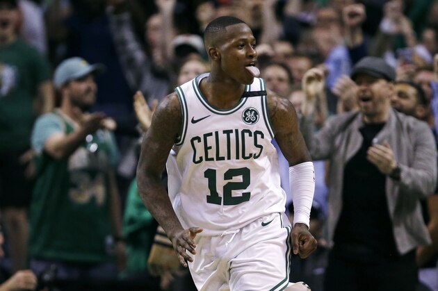 Boston Celtics guard Terry Rozier celebrates after a driving to the basket late in the fourth quarter against the Philadelphia 76ers in Game 5 of an NBA basketball playoff series in Boston, Wednesday, May 9, 2018. Rozier scored 24 points as the Celtics defeated the 76ers 114-112. (AP Photo/Charles Krupa)