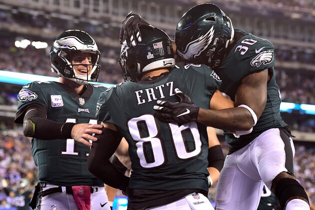 EAST RUTHERFORD, NJ - OCTOBER 11: Carson Wentz #11 of the Philadelphia Eagles and Corey Clement #30 of the Philadelphia Eagles congratulate Zach Ertz #86 of the Philadelphia Eagles after scoring a touchdown against the New York Giants during the second quarter at MetLife Stadium on October 11, 2018 in East Rutherford, New Jersey.  (Photo by Steven Ryan/Getty Images)