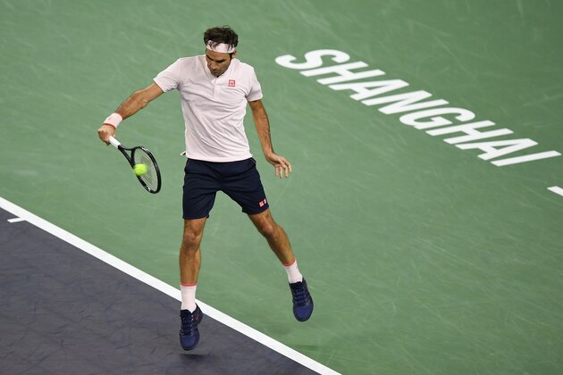 SHANGHAI, CHINA - OCTOBER 11: Roger Federer of Switzerland hits a return against Roberto Bautista Agut of Spain during they third round of the 2018 Rolex Shanghai Masters on Day 5 at Qi Zhong Tennis Centre on October 11, 2018 in Shanghai, China.  (Photo by Zhe Ji/Getty Images)