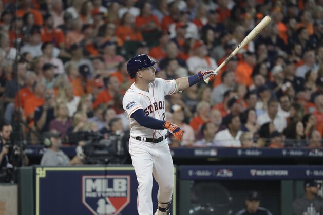 Houston Astros' Alex Bregman watches his solo home run against the Cleveland Indians' Corey Kluber during the fourth inning in Game 1 of an American League Division Series baseball game, Friday, Oct. 5, 2018, in Houston. (AP Photo/David J. Phillip)