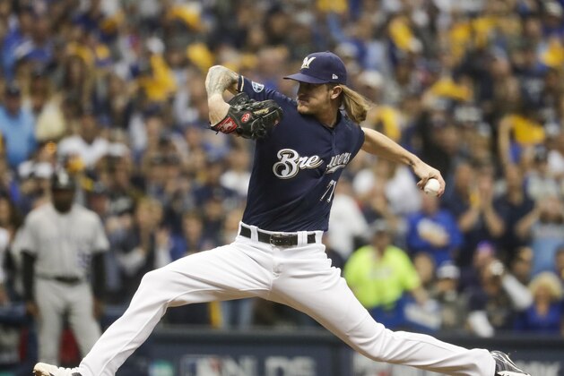 Milwaukee Brewers' Josh Hader throws during the seventh inning of Game 1 of the National League Divisional Series baseball game against the Colorado Rockies Thursday, Oct. 4, 2018, in Milwaukee. (AP Photo/Morry Gash)