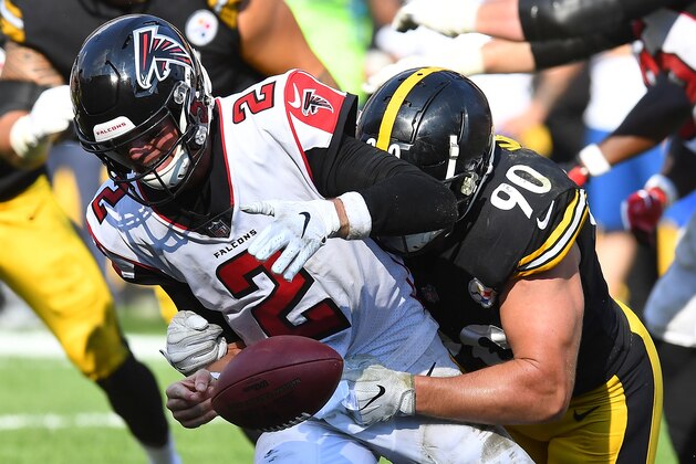 PITTSBURGH, PA - OCTOBER 07: Matt Ryan #2 of the Atlanta Falcons fumbles the ball as he is hit by T.J. Watt #90 of the Pittsburgh Steelers in the fourth quarter during the game at Heinz Field on October 7, 2018 in Pittsburgh, Pennsylvania. (Photo by Joe Sargent/Getty Images)