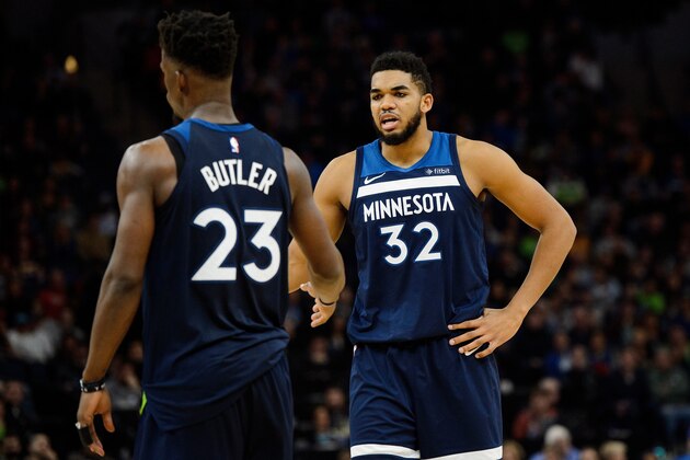 MINNEAPOLIS, MN - JANUARY 01: Karl-Anthony Towns #32 of the Minnesota Timberwolves congratulates teammate Jimmy Butler #23 on drawing a found during the game against the Los Angeles Lakers on January 1, 2018 at the Target Center in Minneapolis, Minnesota. NOTE TO USER: User expressly acknowledges and agrees that, by downloading and or using this Photograph, user is consenting to the terms and conditions of the Getty Images License Agreement. (Photo by Hannah Foslien/Getty Images)