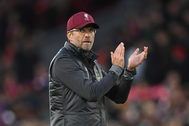 Liverpool's German manager Jurgen Klopp applauds the fans following the English Premier League football match between Liverpool and Manchester City at Anfield in Liverpool, north west England on October 7, 2018. - The match ended 0-0. (Photo by Paul ELLIS / AFP) / RESTRICTED TO EDITORIAL USE. No use with unauthorized audio, video, data, fixture lists, club/league logos or 'live' services. Online in-match use limited to 120 images. An additional 40 images may be used in extra time. No video emulation. Social media in-match use limited to 120 images. An additional 40 images may be used in extra time. No use in betting publications, games or single club/league/player publications. /         (Photo credit should read PAUL ELLIS/AFP/Getty Images)