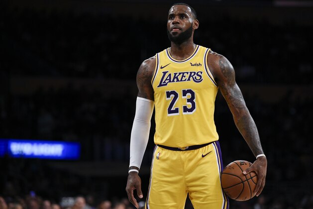 Los Angeles Lakers forward LeBron James attempts a free throw during the first half of an NBA preseason basketball game against the Sacramento Kings in Los Angeles, Thursday, Oct. 4, 2018. (AP Photo/Kelvin Kuo)
