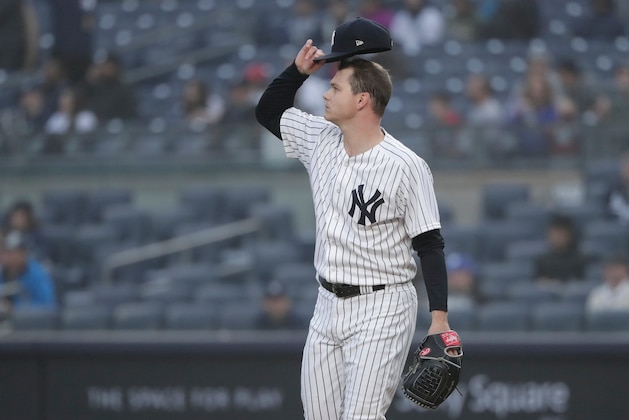 New York Yankees pitcher Sonny Gray adjusts his cap as he watches a two-run home run by Minnesota Twins designated hitter Miguel Sano sail over the center field wall during the first inning of a baseball game, Wednesday, April 25, 2018, in New York. (AP Photo/Julie Jacobson)