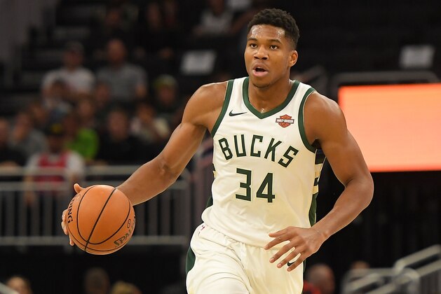 MILWAUKEE, WI - OCTOBER 03:  Giannis Antetokounmpo #34 of the Milwaukee Bucks handles the ball during a preseason game against the Chicago Bulls at the Fiserv Forum on October 3, 2018 in Milwaukee, Wisconsin. NOTE TO USER: User expressly acknowledges and agrees that, by downloading and or using this photograph, User is consenting to the terms and conditions of the Getty Images License Agreement.  (Photo by Stacy Revere/Getty Images)