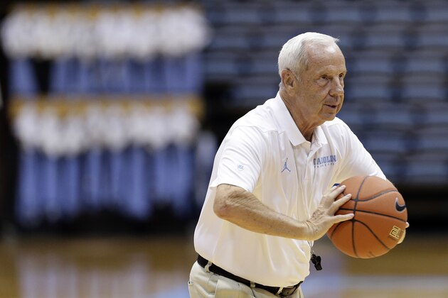 North Carolina coach Roy Williams runs a drill with players during practice following the team's NCAA college basketball media day in Chapel Hill, N.C., Tuesday, Oct. 9, 2018. (AP Photo/Gerry Broome)