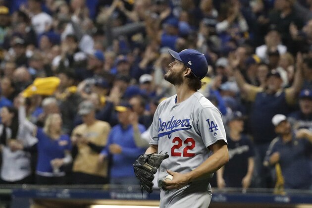 Los Angeles Dodgers starting pitcher Clayton Kershaw (22) reacts after giving up two runs during the fourth inning of Game 1 of the National League Championship Series baseball game against the Milwaukee Brewers Friday, Oct. 12, 2018, in Milwaukee. (AP Photo/Jeff Roberson)