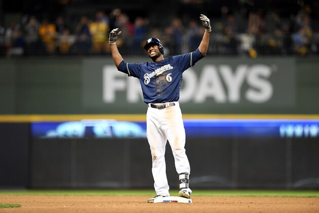 MILWAUKEE, WI - OCTOBER 12:  Lorenzo Cain #6 of the Milwaukee Brewers reacts after hitting a double against the Los Angeles Dodgers during the sixth inning in Game One of the National League Championship Series at Miller Park on October 12, 2018 in Milwaukee, Wisconsin.  (Photo by Stacy Revere/Getty Images)