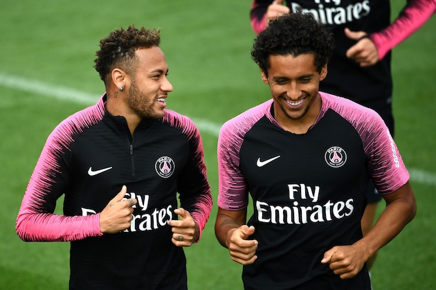 Paris Saint-Germain's Brazilian forward Neymar (L) a nd Paris Saint-Germain's Brazilian defender Marquinhos during a training session at Saint-Germain-en-Laye, western Paris on August 31, 2018 on the eve of the French L1 football match between Paris Saint-Germain and NImes. (Photo by FRANCK FIFE / AFP)        (Photo credit should read FRANCK FIFE/AFP/Getty Images)